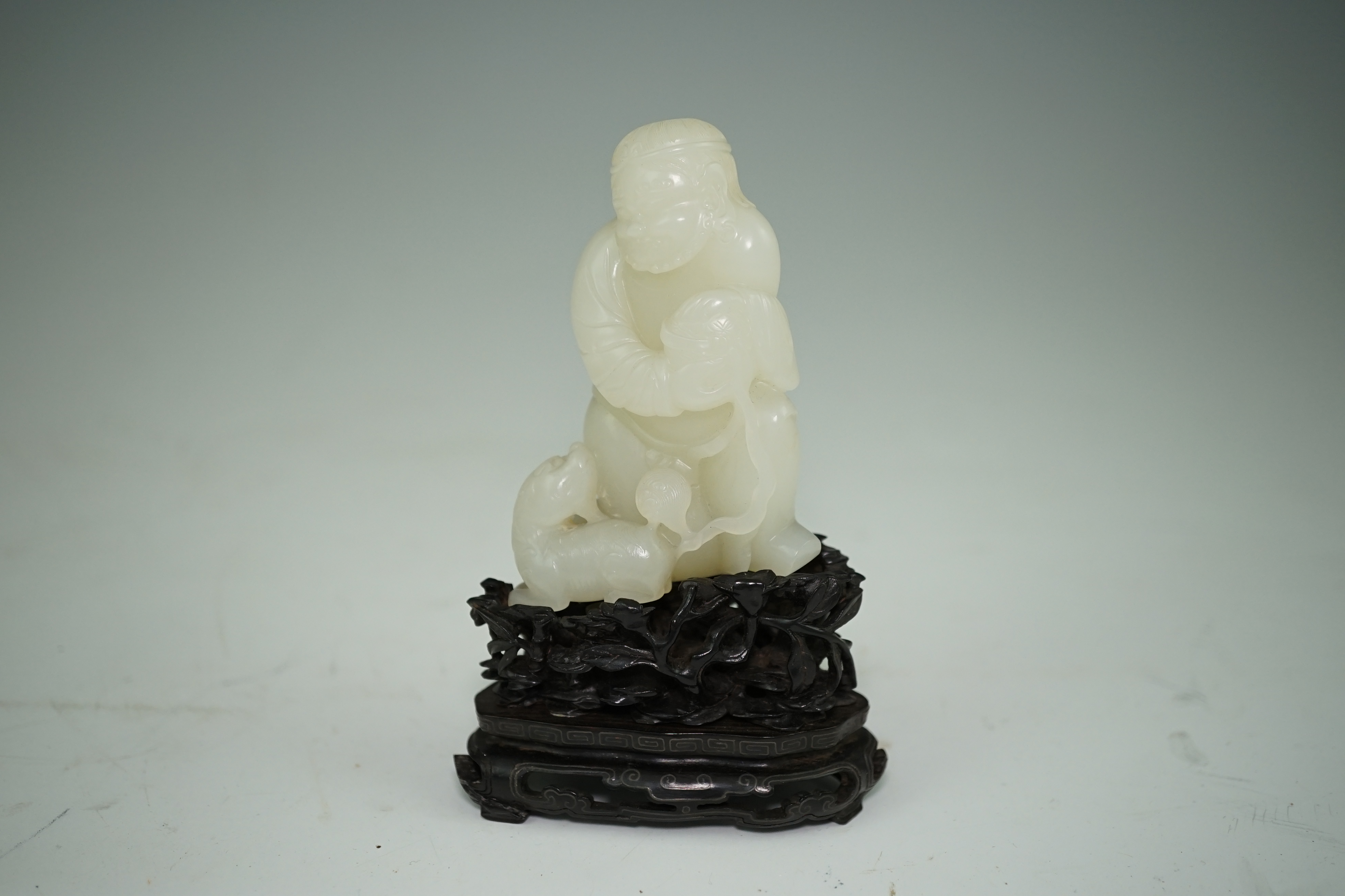 A fine Chinese white jade group of a bearded foreigner, 18th century